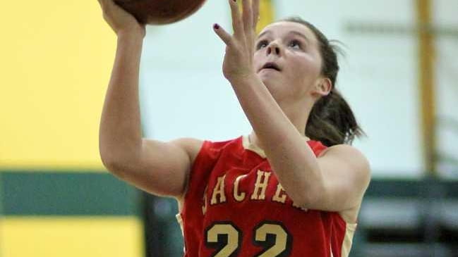 Sachem East's Meagan Doherty goes in for the layup against...