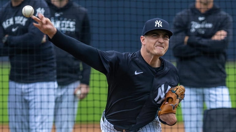 Yankees pitcher Ron Marinaccio throws live batting practice with bullpen coach...