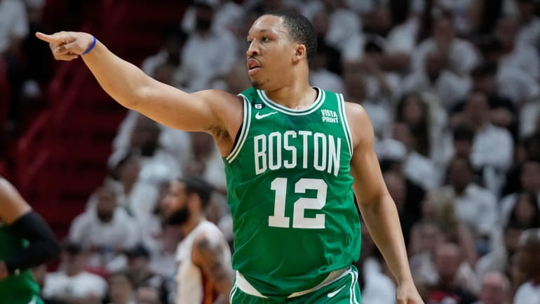 Boston Celtics forward Grant Williams (12) gestures to his teammates...