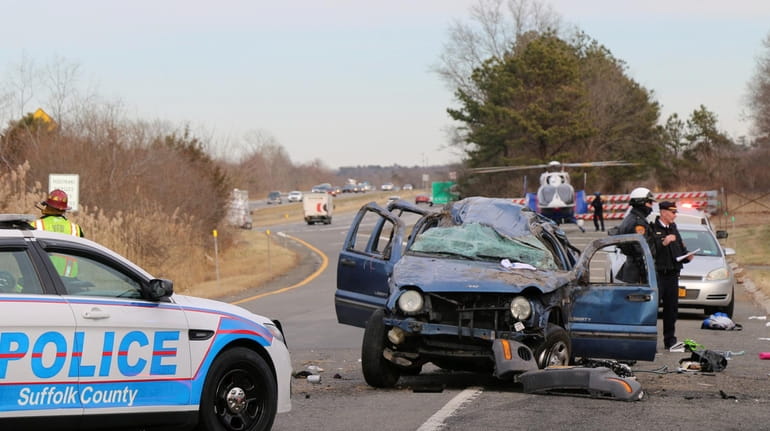 Suffolk police on an LIE service road in Yaphank Monday where a...