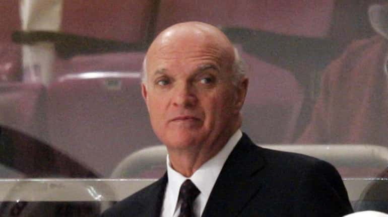 Lou Lamoriello stands behind the bench during a game on...