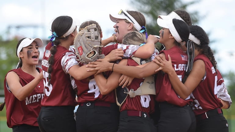 Mepham softball teammates celebrate after their county championship-clinching 10-4 win...