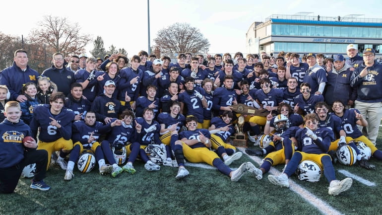 Massapequa poses with the Long Island Class I championship trophy...