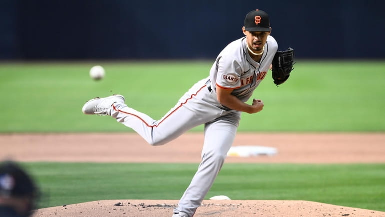 San Francisco Giants starting pitcher Jordan Hicks delivers during the...