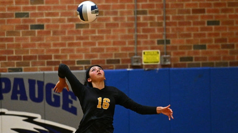 Mikalah Curran of Commack serves during the Suffolk high school...
