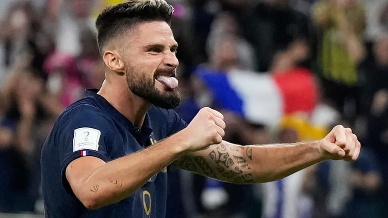 France's Olivier Giroud celebrates after Kylian Mbappe scored their side's...