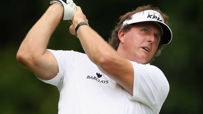 Phil Mickelson in action during the pro-am event prior to...