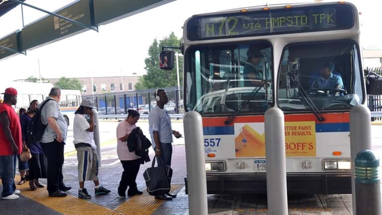 MTA customers board the N72 Long Island Bus at the...