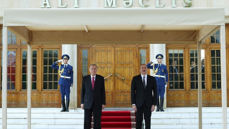 In this handout photo released by Turkish Presidency, Azerbaijan's President...