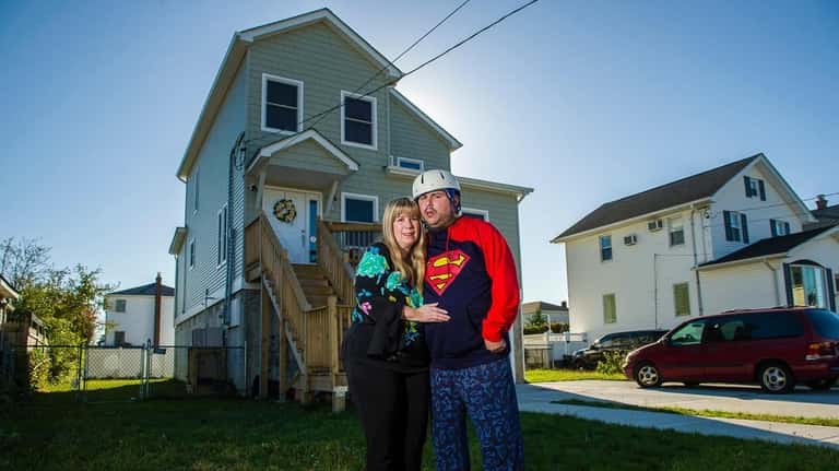 Phyllis Boland and her son, Andrew, outside their new East Rockaway...