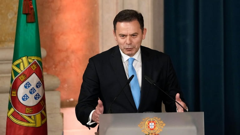 Prime Minister Luis Montenegro delivers a speech after being sworn...