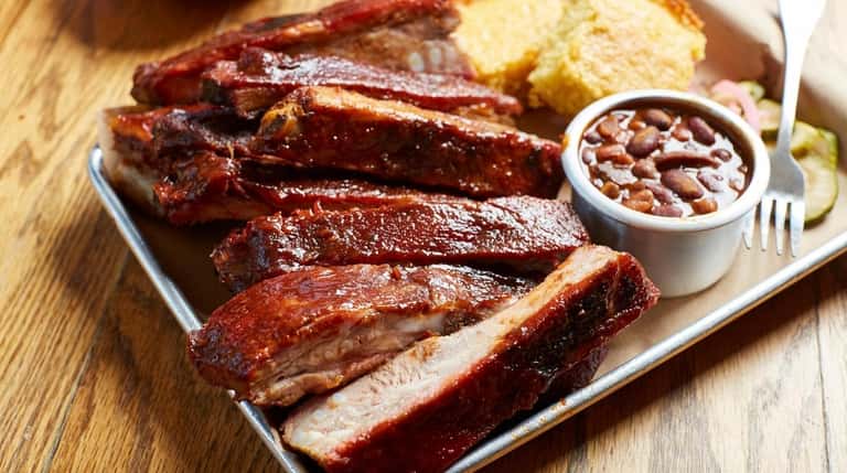 St. Louis style ribs, cornbread and baked beans at Swingbelly's in...