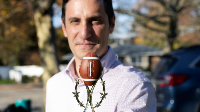 Frank Rampello, dean of students at Farmingdale State College, plays flag football with longtime...