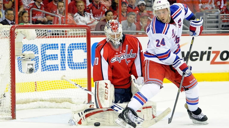 Braden Holtby of the Washington Capitals makes a save in...