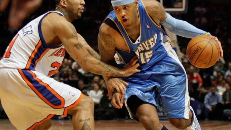 Denver Nuggets forward Carmelo Anthony (15) drives past New York...