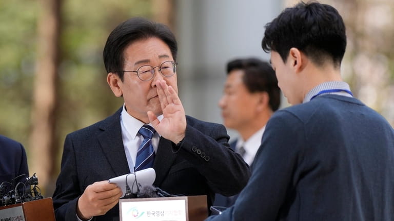 South Korea's main opposition Democratic Party leader Lee Jae-myung, left,...