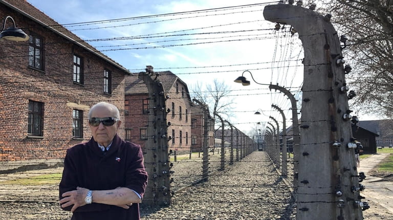 Irving Roth is seen in front of Auschwitz in March 2019....