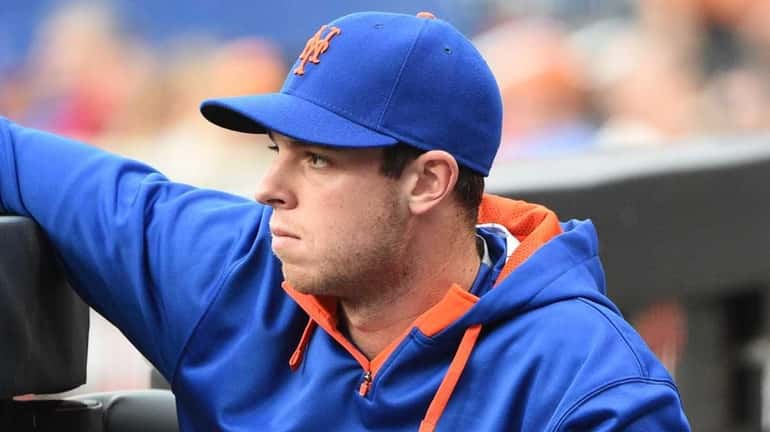 Mets pitcher Steven Matz looks on from the dugout against...