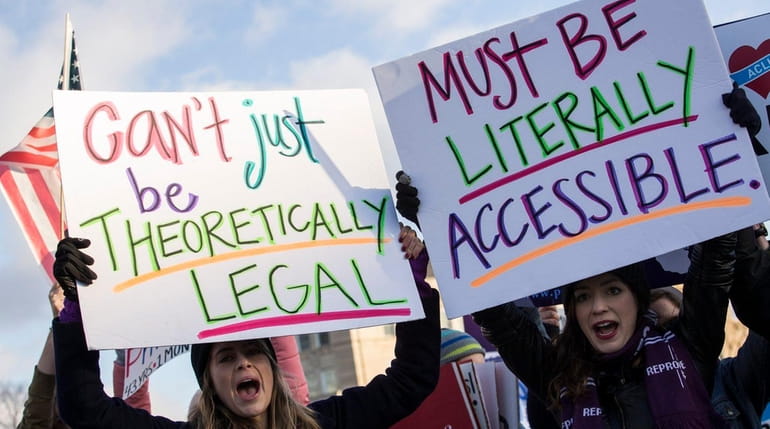 Pro-choice advocates rally outside of the Supreme Court on March...