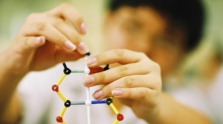 A child plays with DNA blocks.