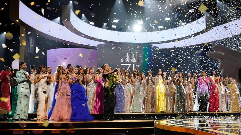 Miss USA R'Bonney Gabriel points on stage after being crowned...