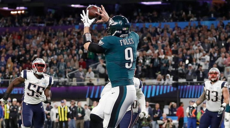 The Eagles' Nick Foles catches a touchdown pass during the...
