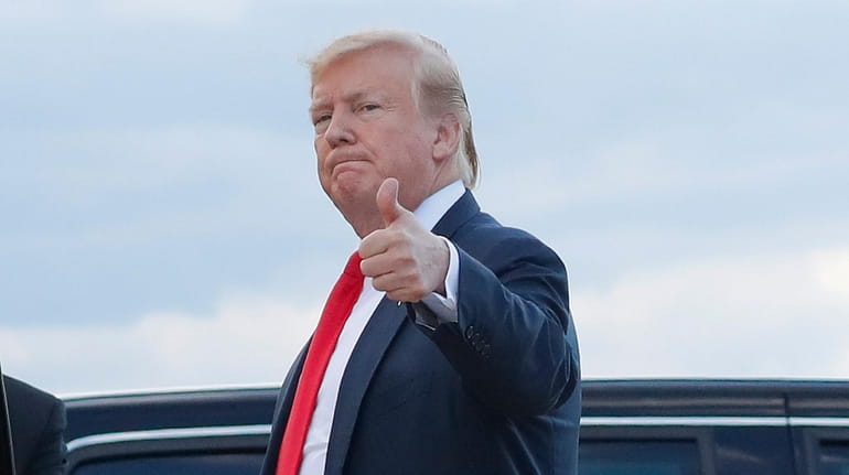 President Donald Trump gives a thumbs-up on Monday as he arrives...