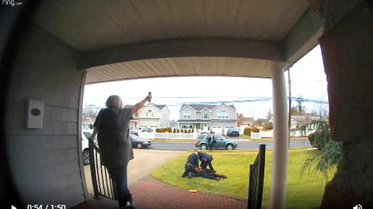 A doorbell-camera view of the arrest of a man suspected...