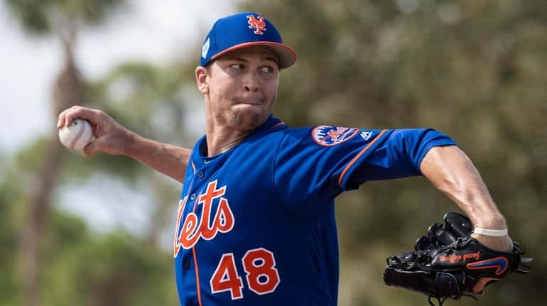 Mets pitcher Jacob deGrom throws a live batting session on...