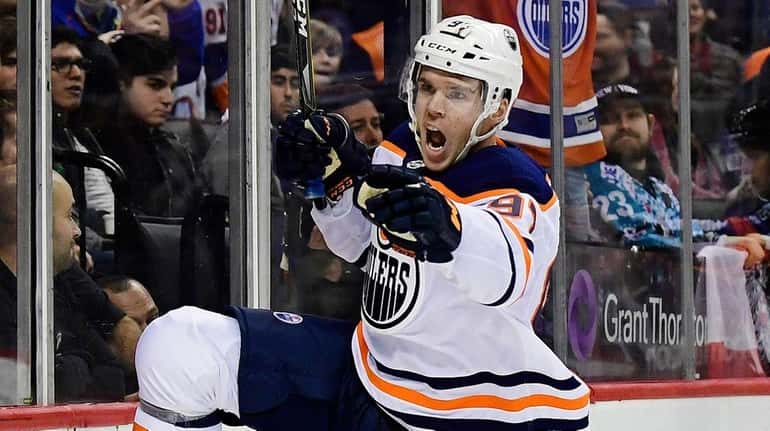 The Oilers' Connor McDavid reacts after scoring the game-winner in...