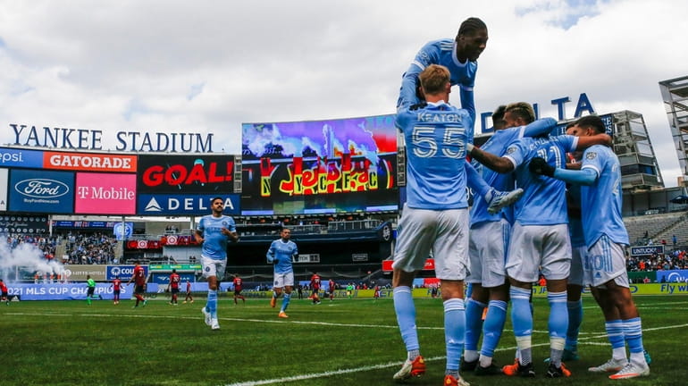 New York City FC players celebrate a goal against Real...