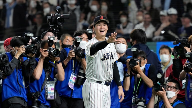 Shohei Ohtani of Japan gestures after finishing the quarterfinal game...