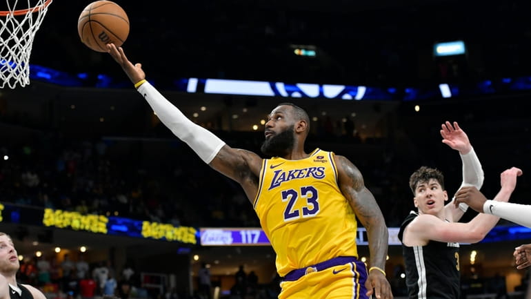 Los Angeles Lakers forward LeBron James (23) shoots next to...