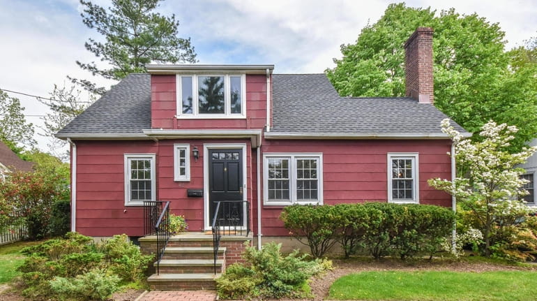 This Cape has lush gardens and views of Mill Pond.