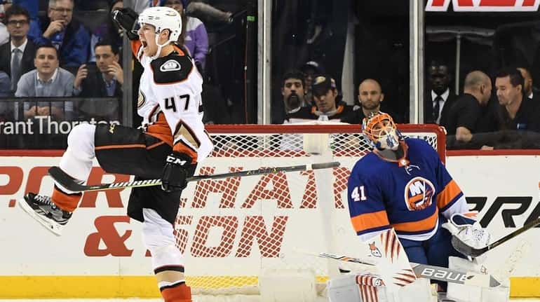 Islanders goalie Jaroslav Halak reacts after Ducks defenseman Hampus Lindholm,...