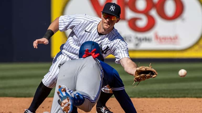 New York Yankees' second baseman DJ LeMahieu could not handle...