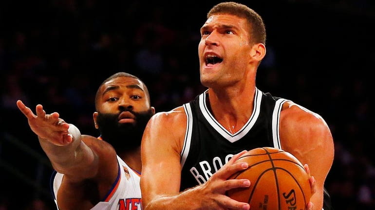 Brook Lopez of the Brooklyn Nets goes to the hoop...