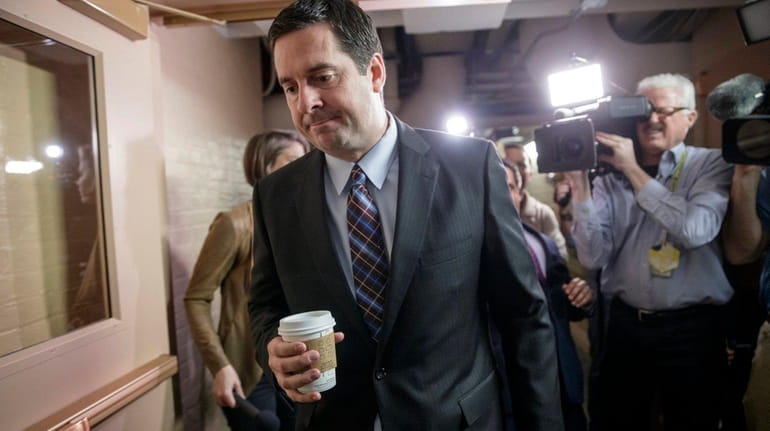 House intelligence committee chairman Devin Nunes is pursued by reporters...