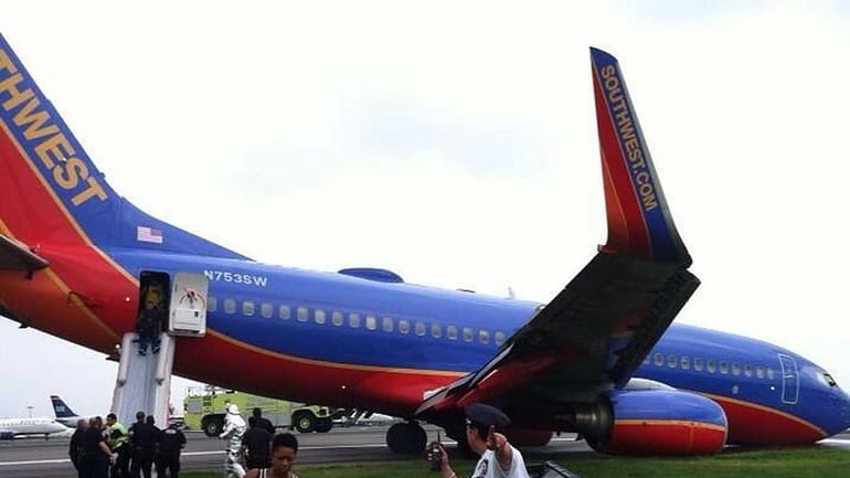 A Southwest Airlaine plane landed at LaGuardia Airport without the...