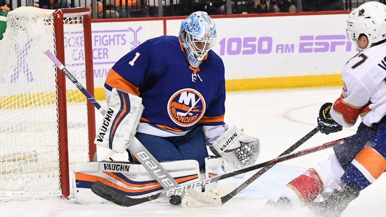 Islanders goaltender Thomas Greiss makes a save against Florida Panthers...