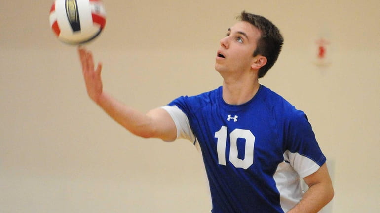 Kellenberg's Michael Fulop makes a serve during the CHSAA varsity...