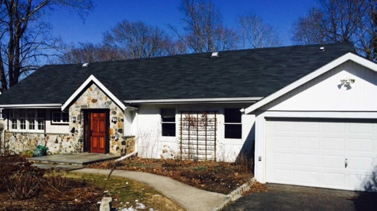 This seven-room Port Jefferson ranch with two bedrooms and two...