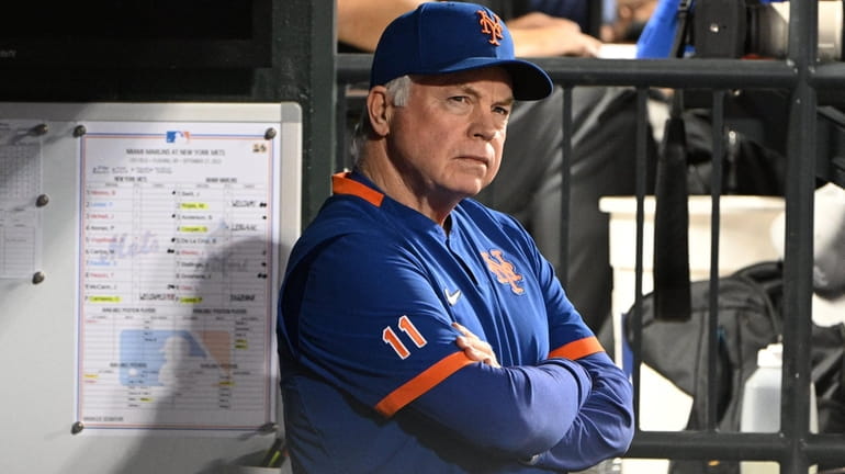 Mets manager Buck Showalter looks on from the dugout against...