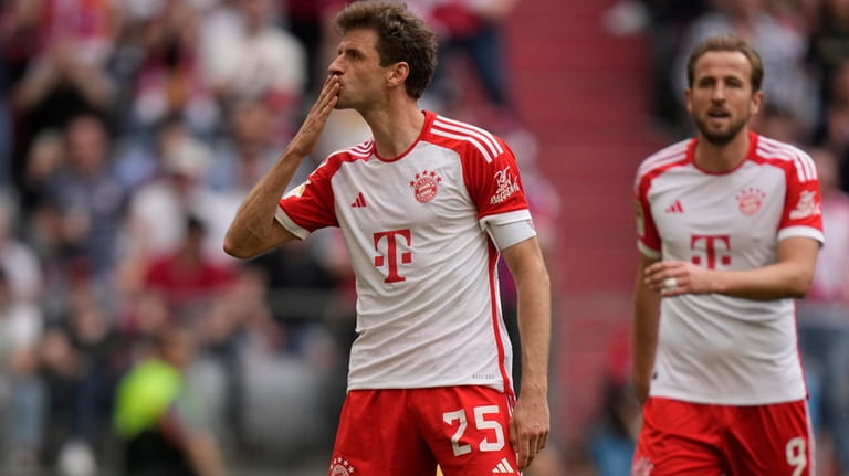 Bayern's Thomas Mueller celebrates after scoring his side's second goal...