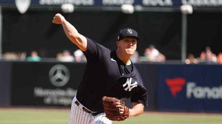 Yankees righthander Jameson Taillon throws during a spring training game...