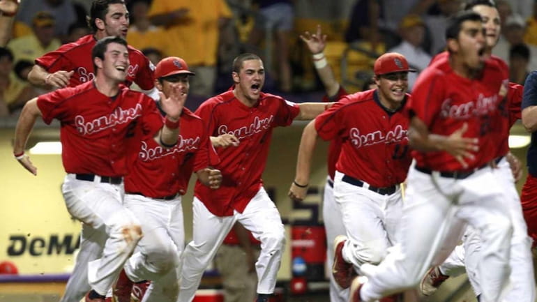 Stony Brook celebrates after defeating LSU 7-2 in Game 3...