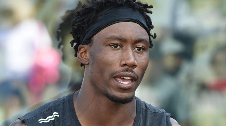 New York Jets wide receiver Brandon Marshall speaks with a...