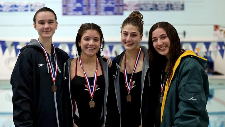 The top four finishers in the Suffolk girls diving championships...