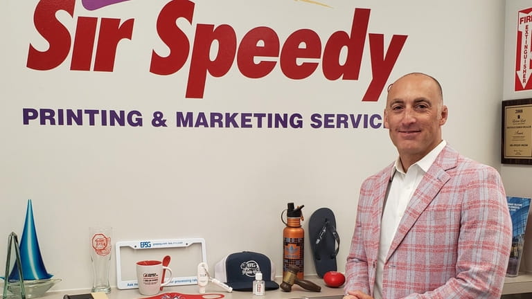 Evan Bloom, co-owner of three Sir Speedy franchise locations on...