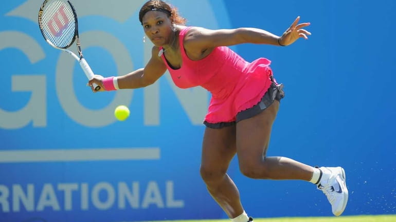 Serena Williams plays a forehand in her match against Tsventana...